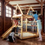 indoor-wooden-playhouse-with-triangle-ladder-slide-board-and-swings-934622